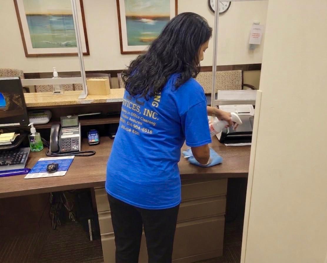 Staff cleaning front desk